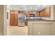 Beautiful kitchen featuring stainless steel appliances, granite countertops, and wood cabinets at 820 Canterra St # 1054, Las Vegas, NV 89138