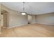 Spacious and naturally lit living room featuring open floor plan and modern light fixture at 820 Canterra St # 1054, Las Vegas, NV 89138