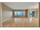 Bright living room with wood floors, large windows and sliding glass doors to an outdoor space at 820 Canterra St # 1054, Las Vegas, NV 89138