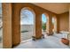 Covered patio with arched columns overlooking the backyard at 820 Canterra St # 1054, Las Vegas, NV 89138
