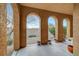 Covered patio with arched columns overlooking the backyard at 820 Canterra St # 1054, Las Vegas, NV 89138