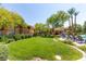 Exterior view of community pool, lounge chairs, landscaping, and community patio at 820 Canterra St # 1054, Las Vegas, NV 89138