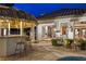 Inviting backyard featuring a covered outdoor kitchen and living space, ideal for entertaining at 8211 Windsor Crest Ct, Las Vegas, NV 89123