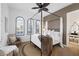 Inviting bedroom with a four-poster bed, neutral decor, and natural light at 8211 Windsor Crest Ct, Las Vegas, NV 89123