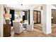 Inviting dining room area featuring wood floors, modern furnishings, and neutral colors at 8211 Windsor Crest Ct, Las Vegas, NV 89123