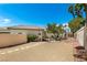 Property exterior featuring desert landscaping, metal gates, and a well-maintained exterior at 8211 Windsor Crest Ct, Las Vegas, NV 89123