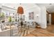 Bright living room featuring a large window, modern decor, and wood floors at 8211 Windsor Crest Ct, Las Vegas, NV 89123