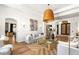 Well-lit living room featuring modern decor, wood flooring and neutral color palette at 8211 Windsor Crest Ct, Las Vegas, NV 89123