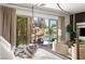 Luxurious main bedroom with backyard views and relaxing seating area at 8211 Windsor Crest Ct, Las Vegas, NV 89123