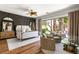 Inviting main bedroom features stylish furnishings and access to the backyard at 8211 Windsor Crest Ct, Las Vegas, NV 89123