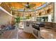 Outdoor kitchen with built in sink, stainless steel grill, counter space and shade cover at 8211 Windsor Crest Ct, Las Vegas, NV 89123