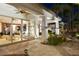 Covered patio with outdoor seating overlooking the backyard, perfect for al fresco dining and entertaining at 8211 Windsor Crest Ct, Las Vegas, NV 89123