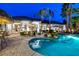 Beautiful backyard pool and spa surrounded by lush landscaping, perfect for relaxation at 8211 Windsor Crest Ct, Las Vegas, NV 89123