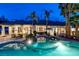 Aerial view of the backyard featuring a large pool, spa, lush landscaping, and serene setting at 8211 Windsor Crest Ct, Las Vegas, NV 89123