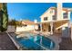 Backyard showcasing a sparkling pool and covered patio area at 8217 Maplestar Rd, Las Vegas, NV 89128