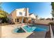 Inviting backyard features a sparkling pool and spa, perfect for outdoor relaxation and entertaining at 8217 Maplestar Rd, Las Vegas, NV 89128