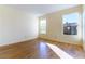 Bedroom with laminate wood flooring, neutral wall color, and lots of natural light at 8217 Maplestar Rd, Las Vegas, NV 89128