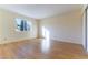 Bedroom with laminate wood flooring, neutral wall color, and closet space at 8217 Maplestar Rd, Las Vegas, NV 89128