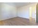 Light-filled bedroom with wood-look flooring and neutral walls at 8217 Maplestar Rd, Las Vegas, NV 89128