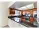 Modern kitchen featuring stainless steel appliances, granite countertops, and a wine rack at 8217 Maplestar Rd, Las Vegas, NV 89128