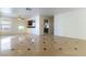 Open-concept living area with tile flooring, connecting seamlessly to the kitchen and other living spaces at 8217 Maplestar Rd, Las Vegas, NV 89128