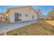 Backyard featuring a sliding glass door, block wall and dry landscaping at 8728 Honey Vine Ave, Las Vegas, NV 89143