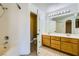 Bathroom with double sink vanity and a separate tiled shower and tub at 8728 Honey Vine Ave, Las Vegas, NV 89143