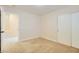 This bedroom has carpet, neutral walls, an open doorway, and a sliding-door closet at 8728 Honey Vine Ave, Las Vegas, NV 89143