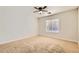 Bright bedroom with carpet and a window offering natural light at 8728 Honey Vine Ave, Las Vegas, NV 89143