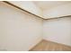 Walk-in closet with built-in shelving and neutral carpet at 8728 Honey Vine Ave, Las Vegas, NV 89143