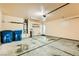 Garage interior featuring a wide door and two blue garbage cans at 8728 Honey Vine Ave, Las Vegas, NV 89143
