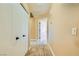 Hallway view featuring a carpet floor and two closet doors on the left at 8728 Honey Vine Ave, Las Vegas, NV 89143