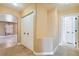 Hallway view featuring neutral paint and closets, archway to another room at 8728 Honey Vine Ave, Las Vegas, NV 89143