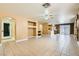 Spacious open floor plan with beige walls, tile flooring, and lots of natural light at 8728 Honey Vine Ave, Las Vegas, NV 89143