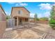 Spacious backyard featuring a covered patio, gravel landscaping, and a storage shed for outdoor needs at 108 Fiery Hill Ave, Henderson, NV 89011
