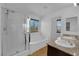 Bright bathroom featuring a separate shower, soaking tub, double sinks, and large window at 108 Fiery Hill Ave, Henderson, NV 89011