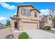 Charming two-story home with a two-car garage, complemented by well-maintained landscaping and a cozy front porch at 108 Fiery Hill Ave, Henderson, NV 89011
