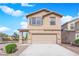 Charming two-story home with a neutral color palette and a convenient two-car garage at 108 Fiery Hill Ave, Henderson, NV 89011