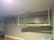 Spacious garage featuring convenient overhead storage racks, ideal for organized storage solutions at 108 Fiery Hill Ave, Henderson, NV 89011