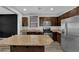 This kitchen features stainless steel appliances, wood cabinets, granite countertops at 108 Fiery Hill Ave, Henderson, NV 89011
