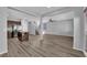 Open-concept living space featuring hardwood floors, a center island and a staircase to the upper level at 108 Fiery Hill Ave, Henderson, NV 89011