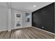 Open-concept living space featuring hardwood floors, access to the backyard and modern lighting fixtures at 108 Fiery Hill Ave, Henderson, NV 89011