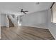 Spacious living room with hardwood floors, a staircase, and plenty of natural light at 108 Fiery Hill Ave, Henderson, NV 89011