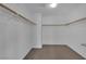 Walk-in closet with carpeted floors and ample shelving and hanging space at 108 Fiery Hill Ave, Henderson, NV 89011