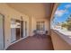 Charming balcony with seating area and views of surrounding neighborhood and palm trees at 108 Lemon Glaze St # 202, Las Vegas, NV 89145