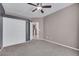 Cozy bedroom with neutral tones, plush carpet, and a ceiling fan for added comfort at 108 Lemon Glaze St # 202, Las Vegas, NV 89145