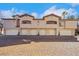 Attractive townhome showcasing multiple private garages and a colorful brick driveway on a sunny day at 108 Lemon Glaze St # 202, Las Vegas, NV 89145