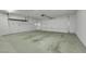 Spacious two car garage with concrete floors and an overhead storage rack installed at 108 Lemon Glaze St # 202, Las Vegas, NV 89145