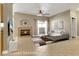 This living room offers a fireplace, a ceiling fan and access to the balcony at 108 Lemon Glaze St # 202, Las Vegas, NV 89145