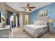 Bright main bedroom with a walk-in closet, balcony access, and stylish decor at 108 Lemon Glaze St # 202, Las Vegas, NV 89145